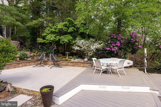 deck featuring outdoor dining area