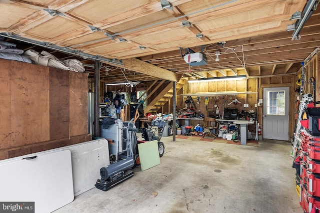 garage featuring a workshop area and a garage door opener