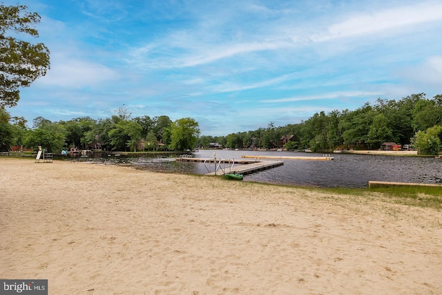 surrounding community with a water view