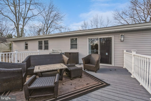 wooden deck featuring outdoor lounge area