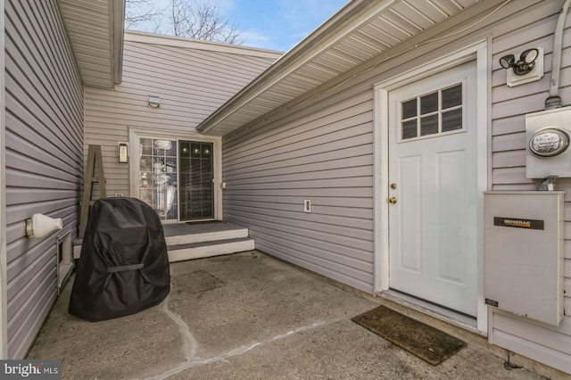 property entrance with a patio