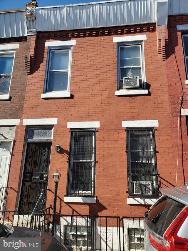 view of property featuring brick siding