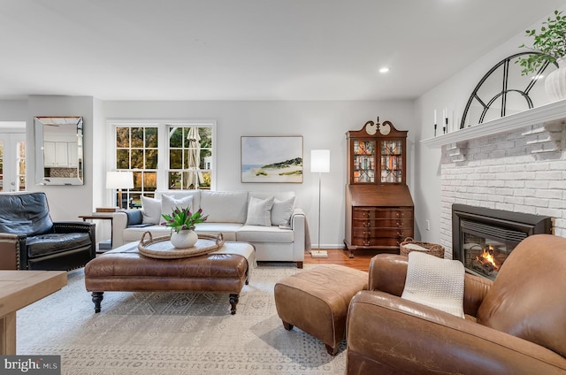 living area featuring recessed lighting and a fireplace