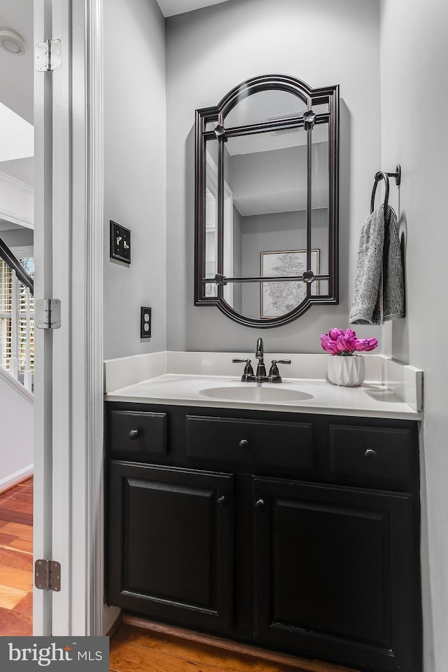 bathroom featuring vanity and wood finished floors