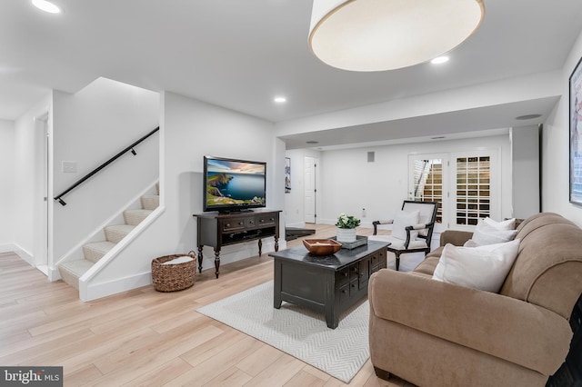 living area featuring recessed lighting, stairway, baseboards, and wood finished floors