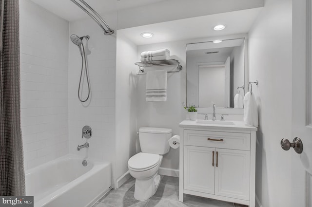 bathroom with toilet, visible vents, vanity, baseboards, and shower / bath combo with shower curtain