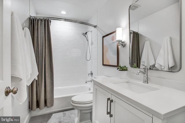 bathroom featuring toilet, shower / tub combo, visible vents, and vanity