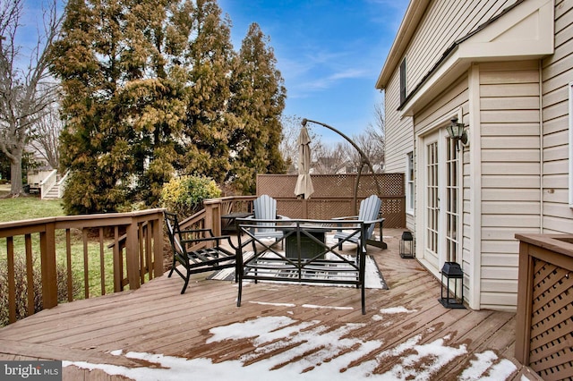 wooden terrace featuring outdoor dining area