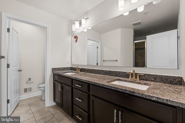 bathroom with visible vents, a sink, and toilet