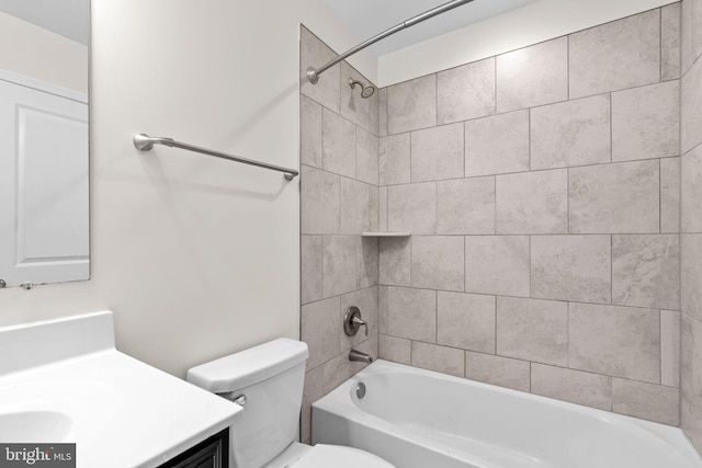 bathroom featuring  shower combination, vanity, and toilet