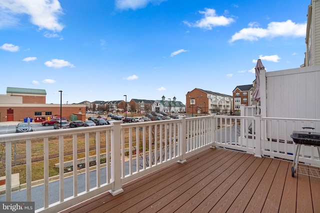 wooden deck with a residential view