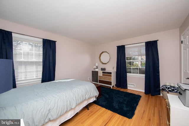 bedroom with light wood finished floors