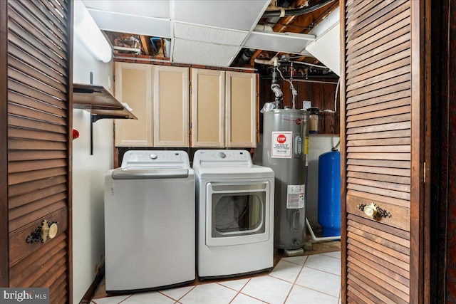 laundry area featuring cabinet space, water heater, separate washer and dryer, and light tile patterned flooring