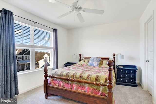 bedroom with carpet floors, a ceiling fan, and baseboards