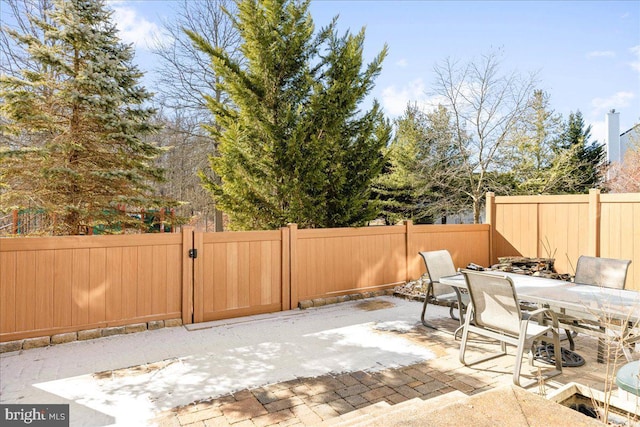 view of patio / terrace featuring outdoor dining space and a fenced backyard