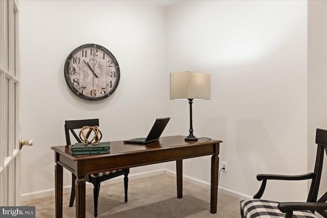 office featuring light carpet and baseboards