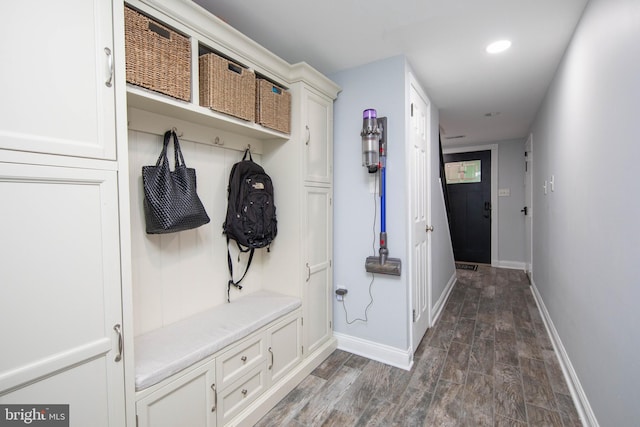 mudroom with dark wood-type flooring, recessed lighting, and baseboards