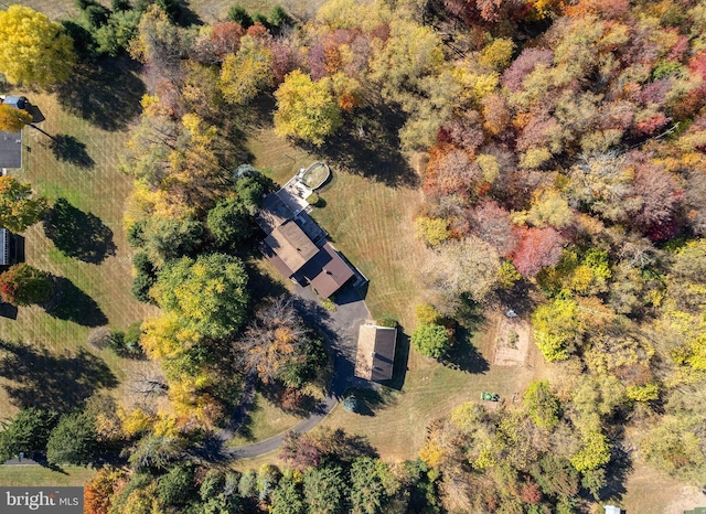 birds eye view of property with a wooded view