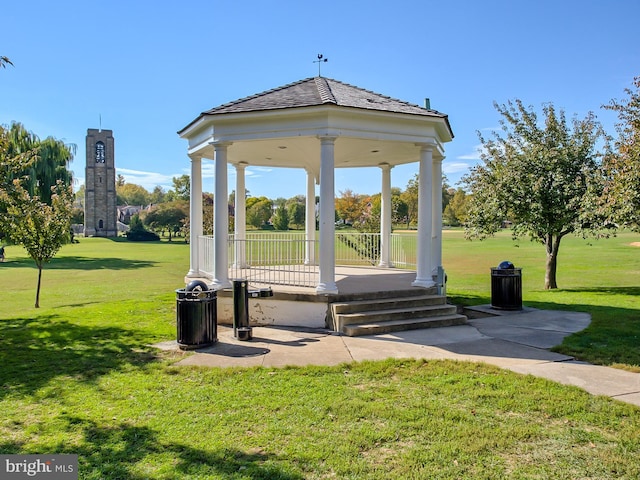 surrounding community with a lawn and a gazebo