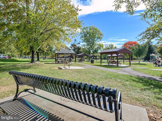 view of property's community featuring a lawn and a gazebo