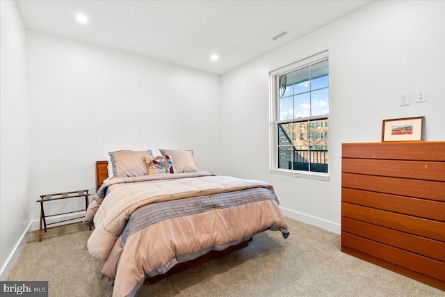 bedroom featuring carpet, visible vents, baseboards, and recessed lighting