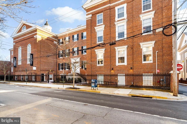 view of building exterior featuring fence