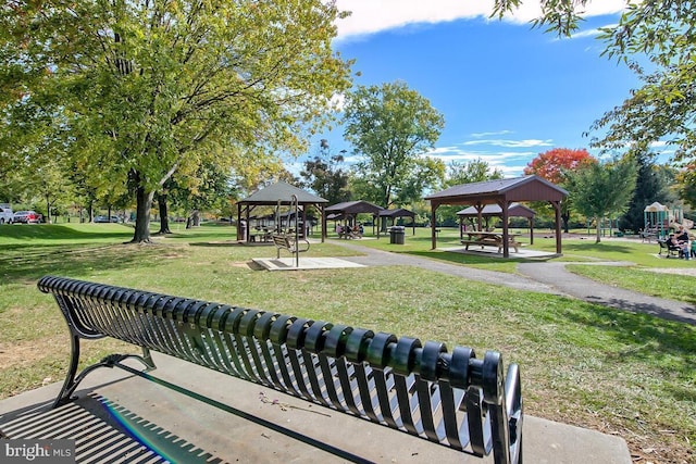 surrounding community with a yard and a gazebo