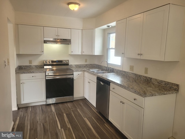 kitchen featuring stainless steel appliances, white cabinetry, a sink, and under cabinet range hood