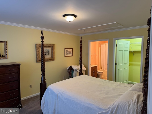 bedroom with attic access, dark carpet, and ornamental molding