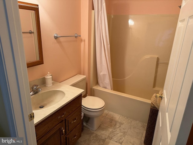 bathroom featuring toilet, shower / tub combo, and vanity