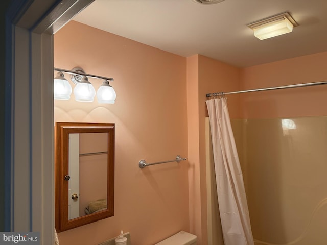 bathroom with a shower with curtain