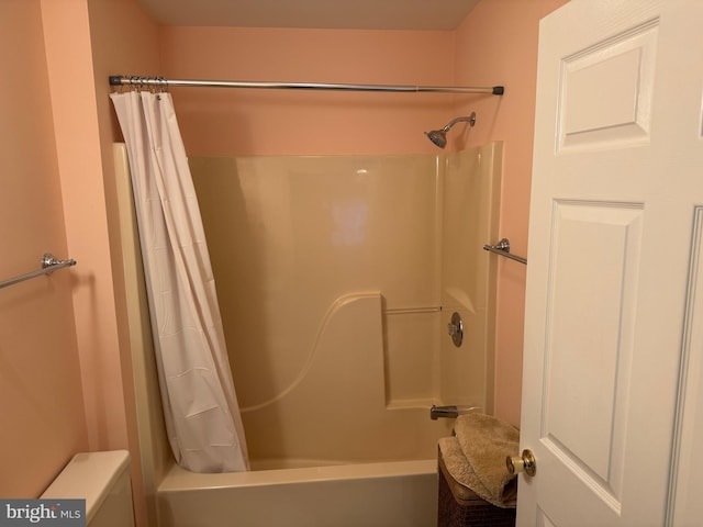 bathroom with shower / bath combination with curtain