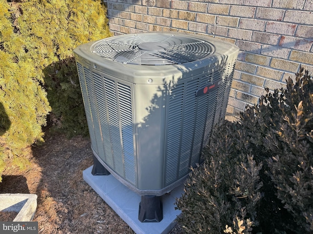 exterior details with central AC and brick siding