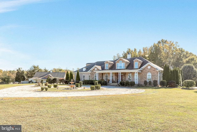 view of front of house with a porch and a front yard