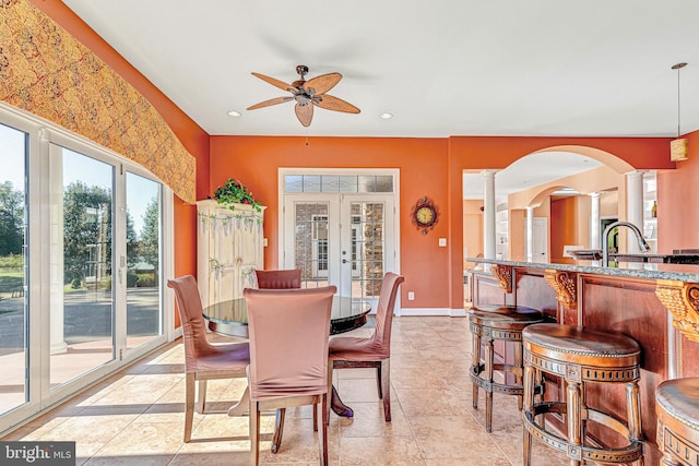 dining room featuring decorative columns, baseboards, a ceiling fan, french doors, and recessed lighting