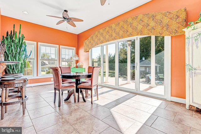 interior space with ceiling fan