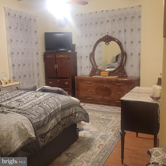 bedroom featuring ceiling fan and light wood finished floors