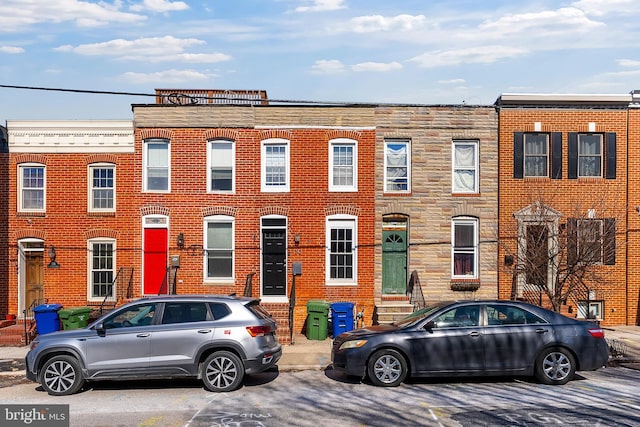 townhome / multi-family property featuring entry steps