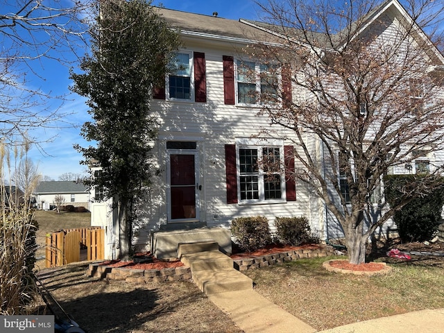 view of front of home with fence