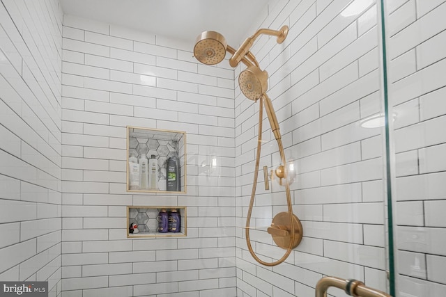 full bath featuring tiled shower