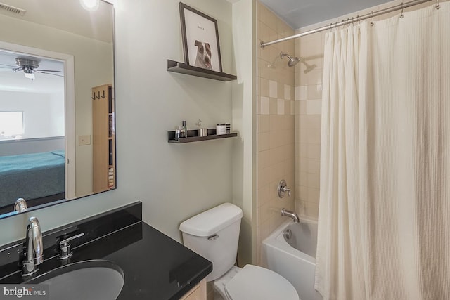 full bath featuring ceiling fan, toilet, shower / tub combo, vanity, and visible vents