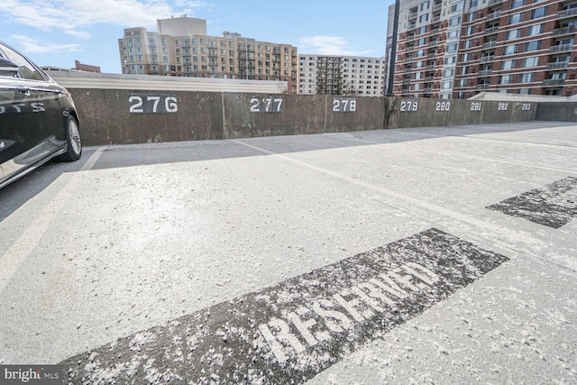 uncovered parking lot with a city view