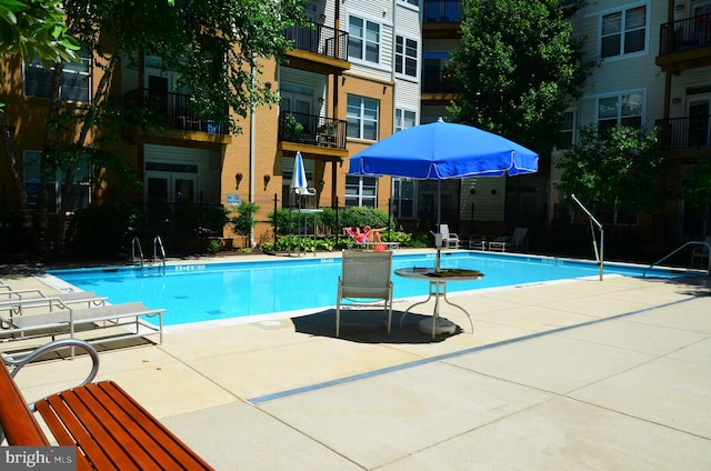 community pool featuring a patio area