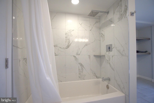 bathroom with shower / bath combo with shower curtain