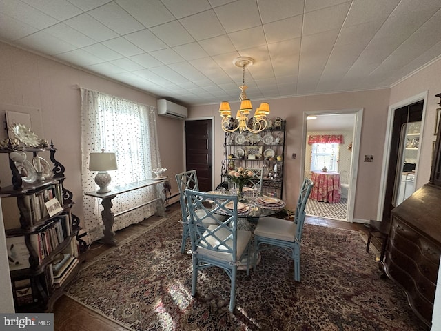 dining space with ornamental molding, a baseboard radiator, a wall mounted air conditioner, and a chandelier