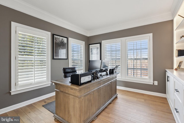 office featuring crown molding, light wood-style flooring, and baseboards