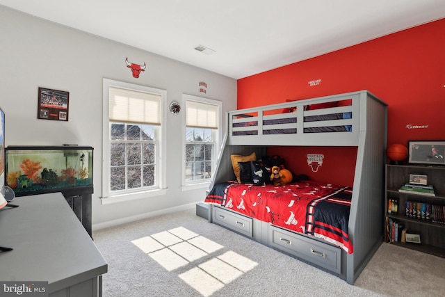 bedroom featuring light carpet and visible vents