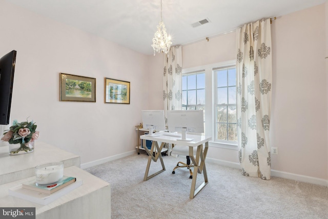 office area featuring baseboards, visible vents, and light colored carpet