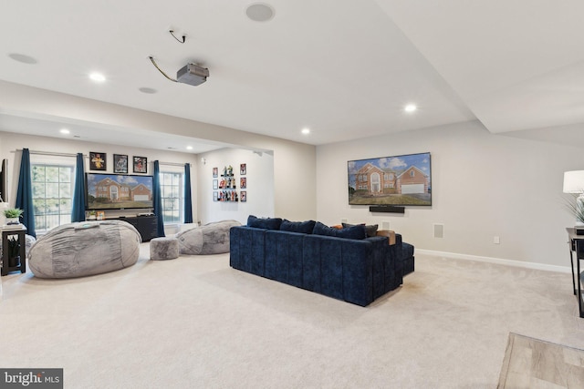 living room with light carpet, recessed lighting, and baseboards