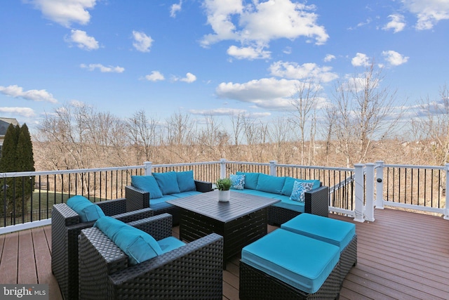 wooden deck with an outdoor living space